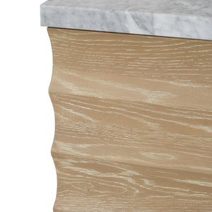 BATH VANITY WITH HORIZONTAL FLUTED DETAIL IN CERUSED OAK WITH WHITE MARBLE TOP, PORCELAIN SINK, AND POLISHED BRASS KNOBS