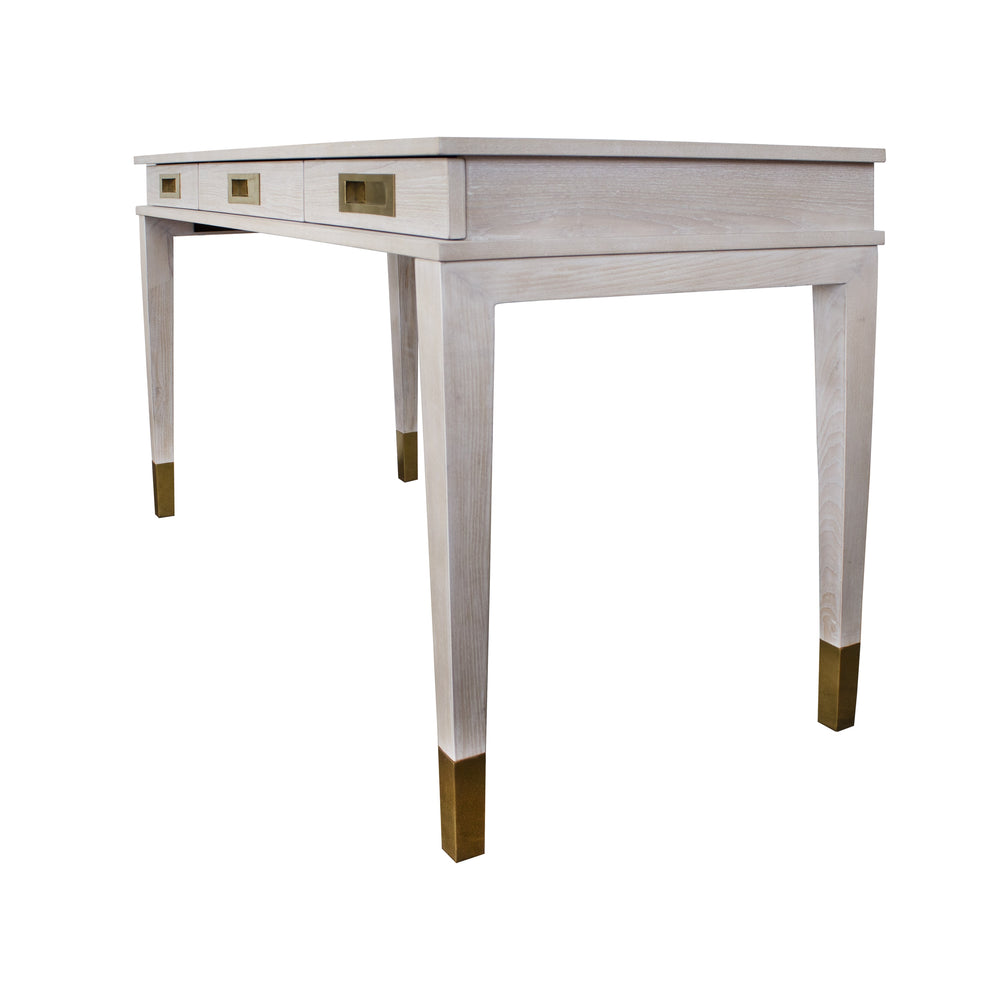 THREE DRAWER DESK WITH BRASS DETAILS IN CERUSED OAK