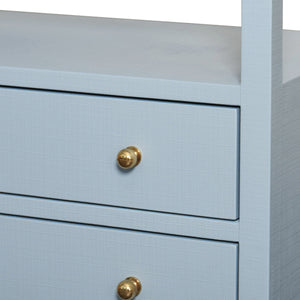TWO DRAWER SIDE TABLE WITH OPEN TOP SHELF IN TEXTURED LIGHT BLUE LINEN WITH POLISHED BRASS KNOBS